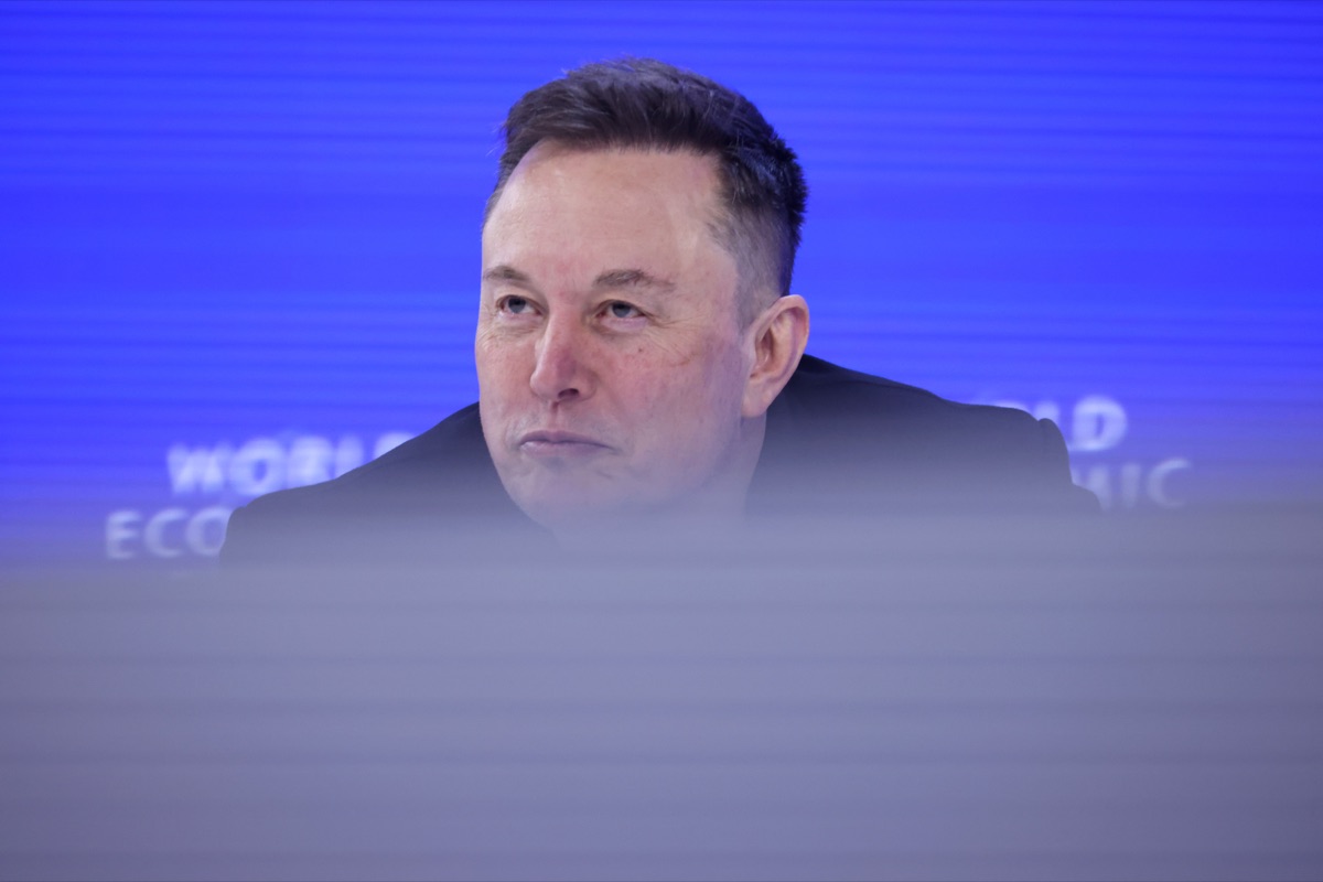 Elon Musk Tesla CEO at World Economic Forum in Davos as Tesla stock falls 3.59% to 373.60 on April 23 2026 after Q1 2026 earnings call reveals $25 billion 2026 capex guide and negative free cash flow for the rest of the year